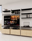 Modular shelving unit with black and Tea for Two shelves and white vertical posts.