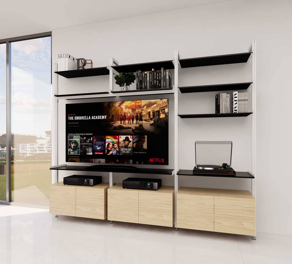 Media center shelving unit with three bays, plus Wb Cfl finish, shown with open shelving.