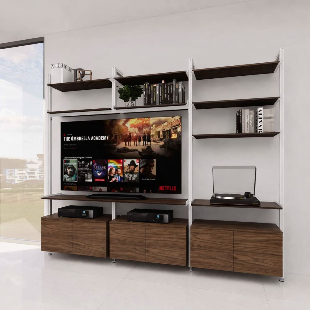 Modular media shelving unit with white shelves and black vertical posts, with Tea for Two wood cabinet storage, two bays, styled as an entertainment storage unit.