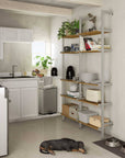 Aluminaire wood inspired modular shelving unit with wood-look aluminum shelves and satin vertical posts, one bay, styled in a modern room.