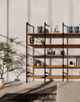 Wood shelf modular shelving unit with white shelves and satin vertical posts, one bay, styled in a modern room.