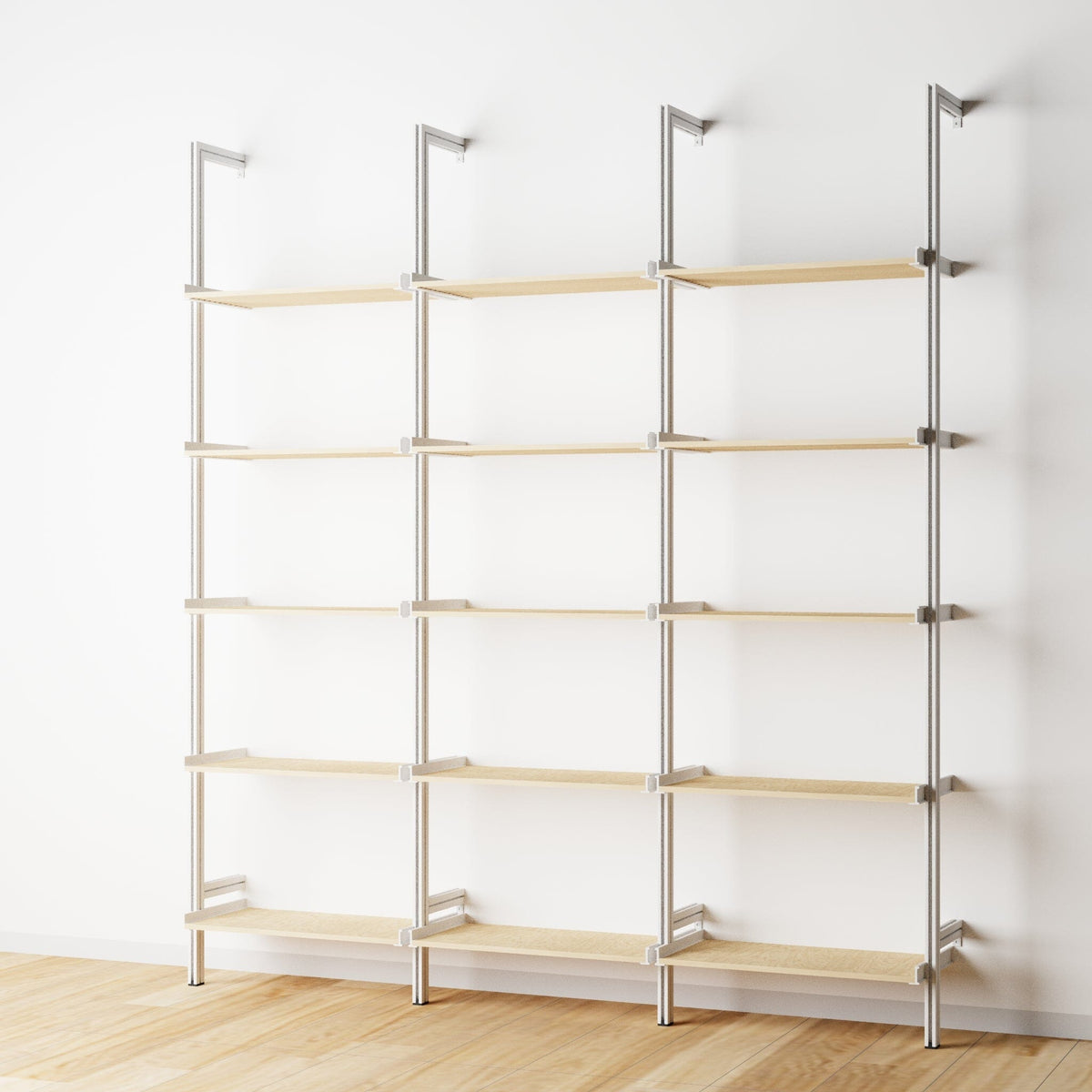 Wood shelf modular shelving unit with Casting Light shelves and white vertical posts, three bays, 24-inch shelf width, shown with open shelf levels.
