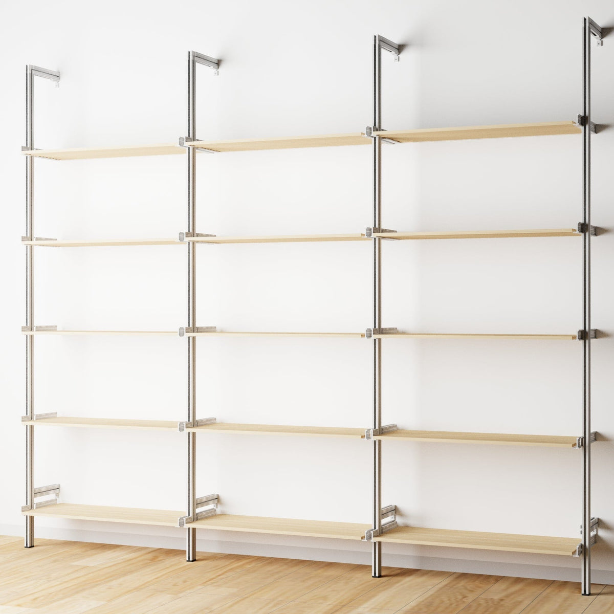 Wood shelf modular shelving extension with Casting Light shelves and satin vertical post, three bays, shown with open shelf levels.