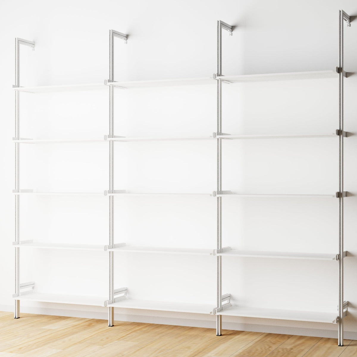 Wood shelf modular shelving extension with white shelves and white vertical post, three bays, shown with open shelf levels.