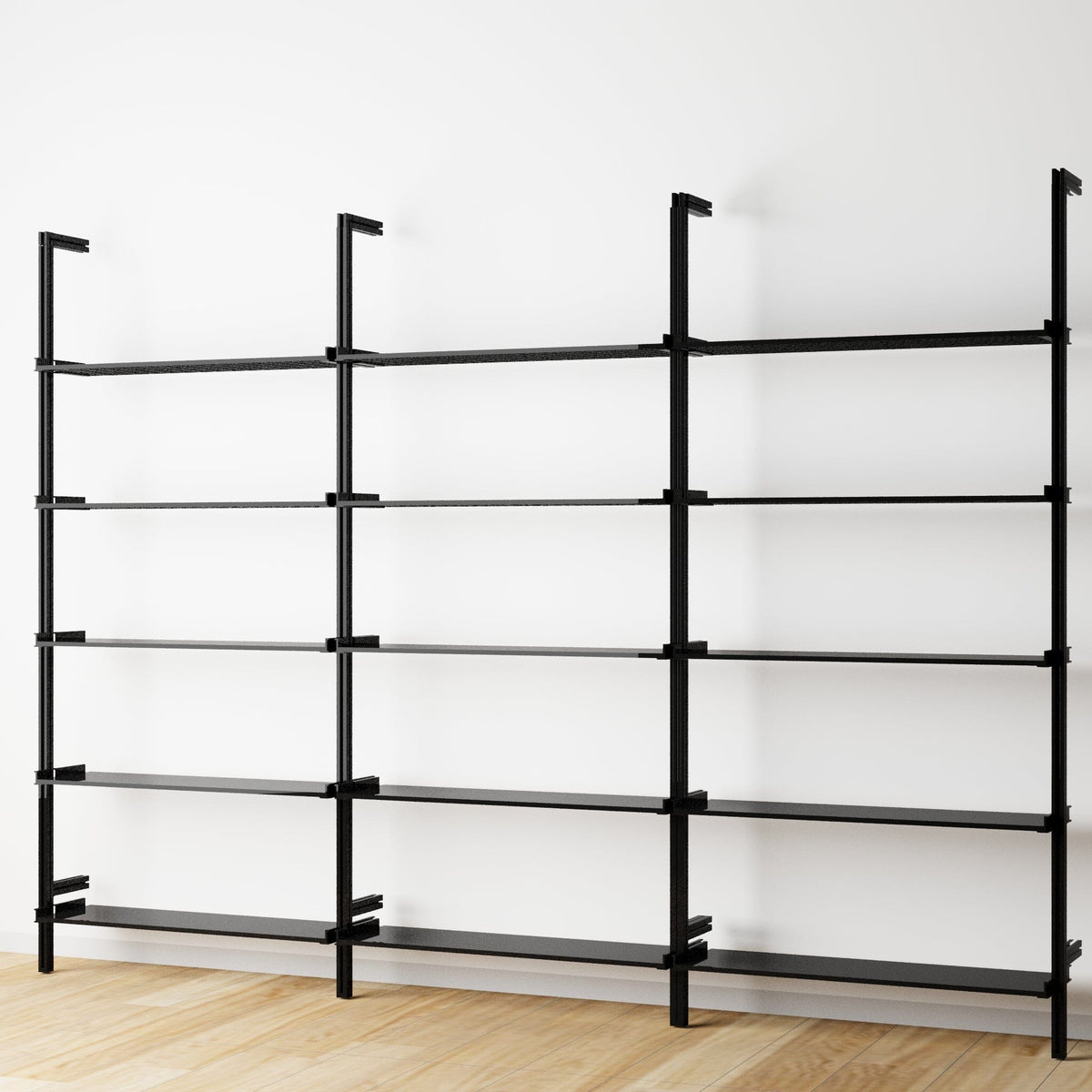 Modular shelving unit with white shelves and black vertical posts, three bays, shown with open shelf levels.
