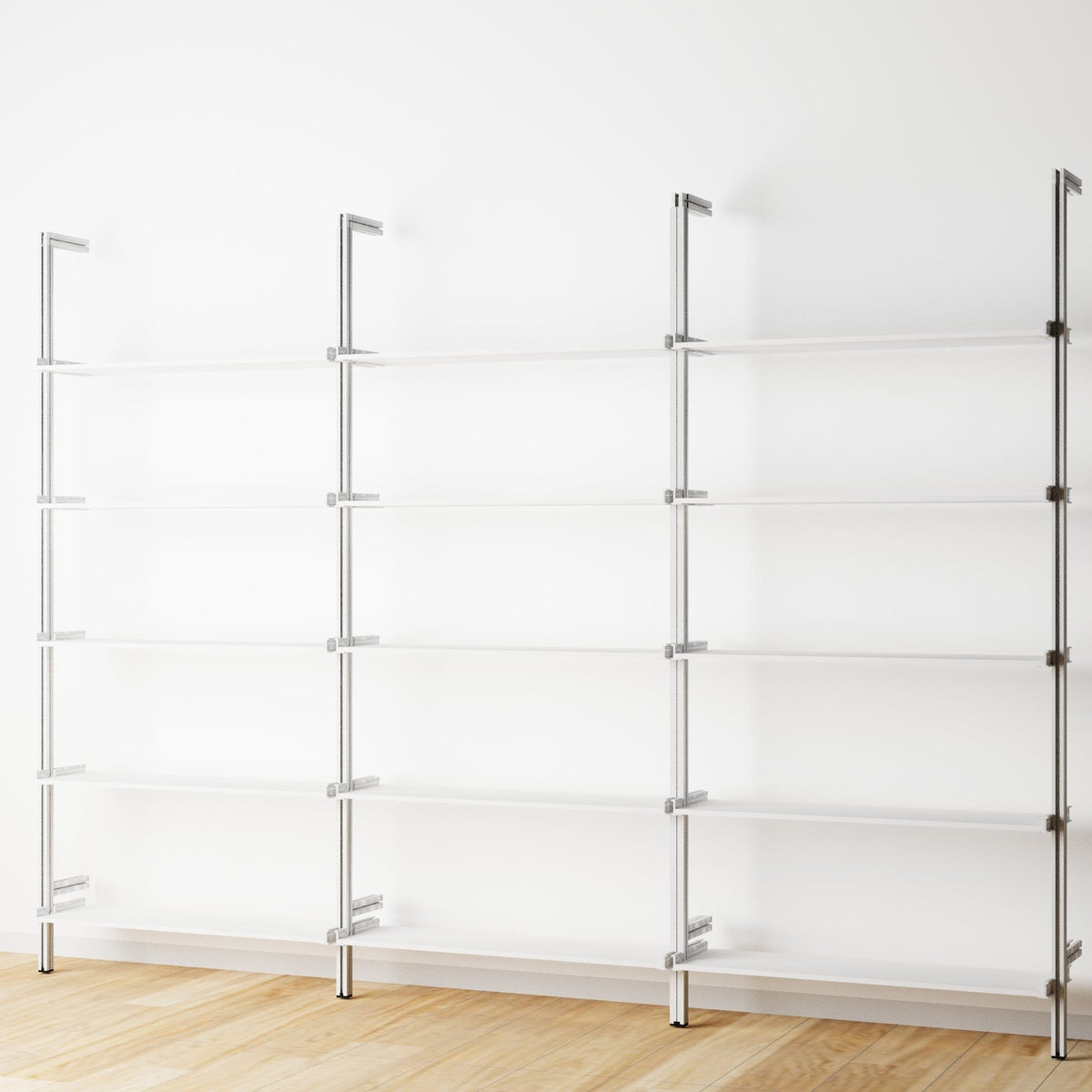 Modular shelving unit with white shelves and satin vertical posts, three bays, 31-inch shelf width, shown with open shelf levels.