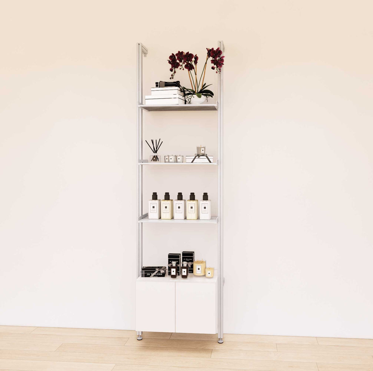 Retail display shelving unit with white shelves, satin vertical posts, and base cabinets in a 24-inch, one-bay configuration, shown with open display shelving.