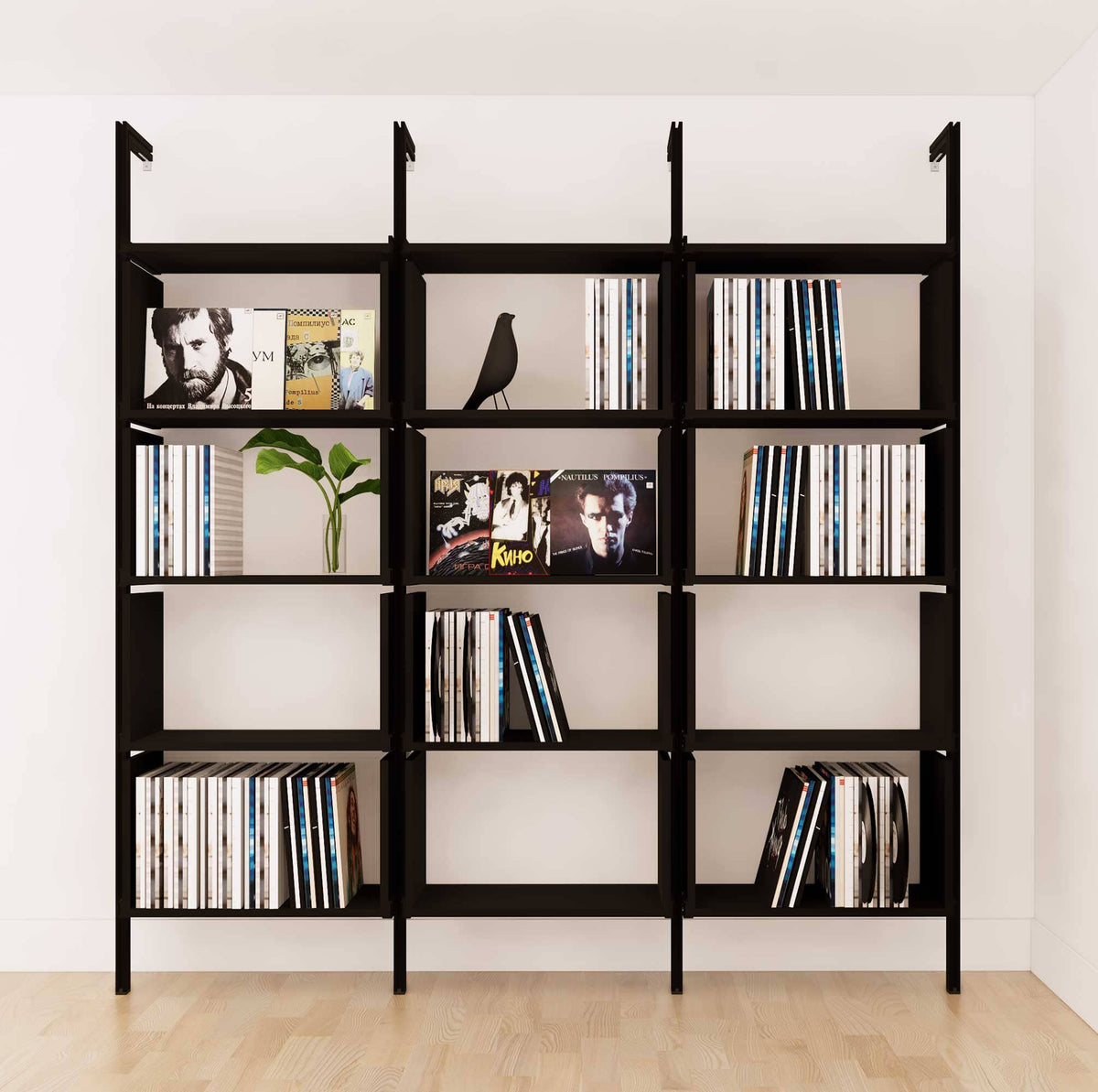 Modular vinyl storage shelving unit with black shelves and black vertical posts, three bays, shown with open record storage shelf levels.