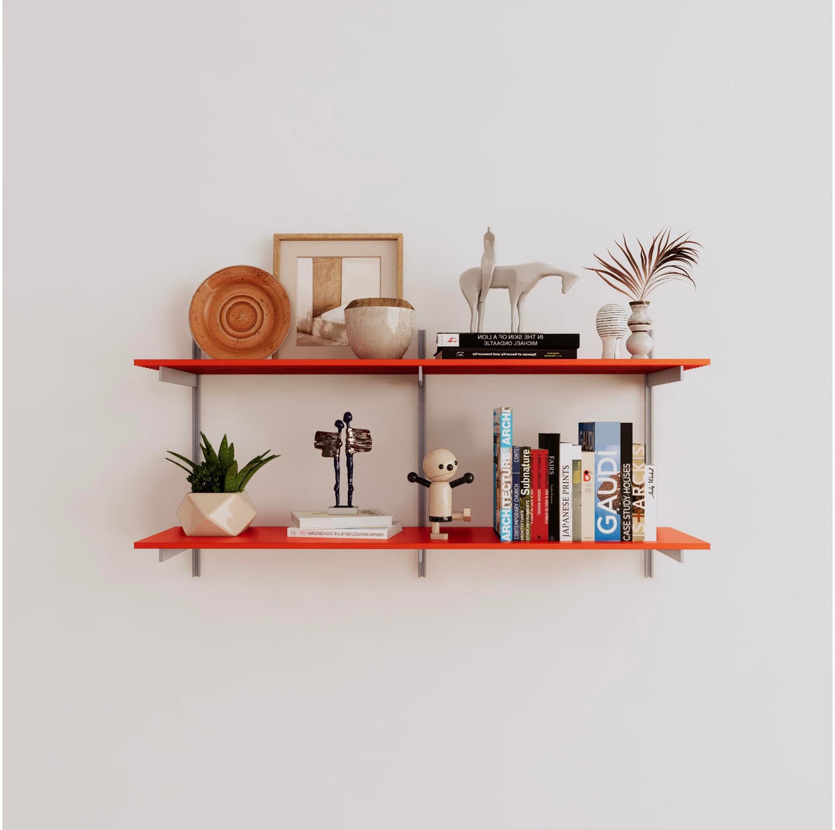 Modular shelving unit with orange shelves, satin vertical posts, and one bay, shown with two open shelf levels.