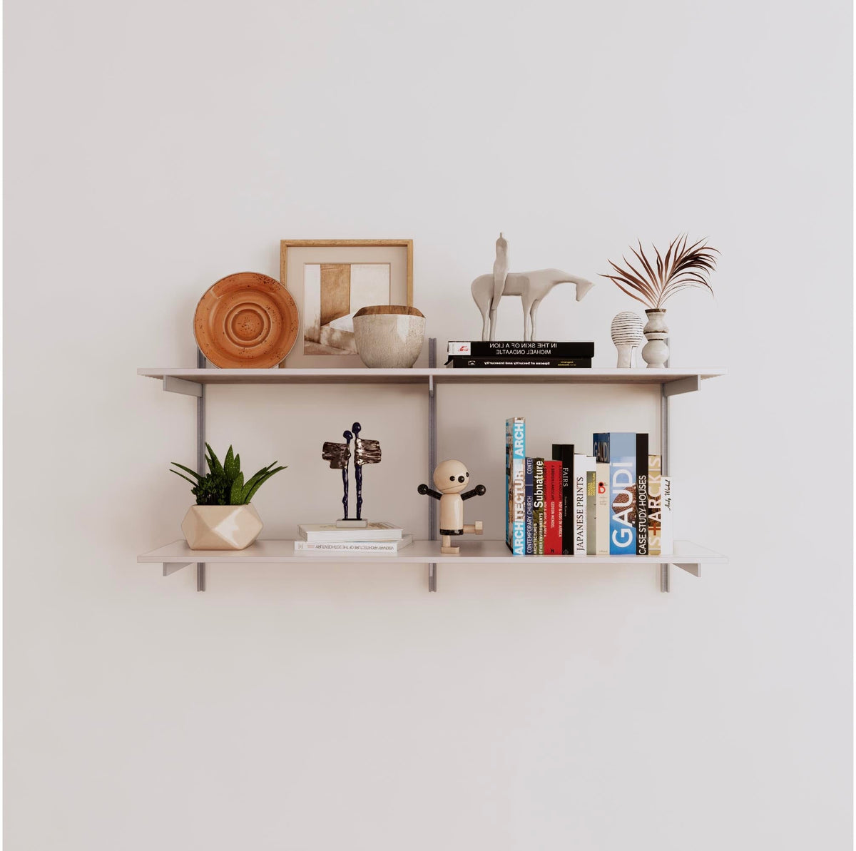 Modular shelving unit with white shelves, satin vertical posts, and one bay, shown with two open shelf levels.