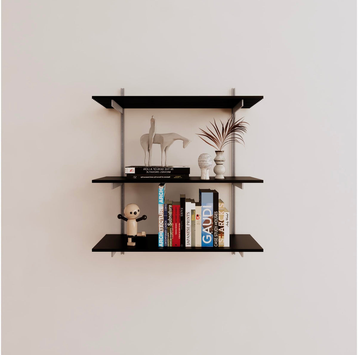Modular shelving unit with black shelves, satin vertical posts, and one bay, shown with three open shelf levels.