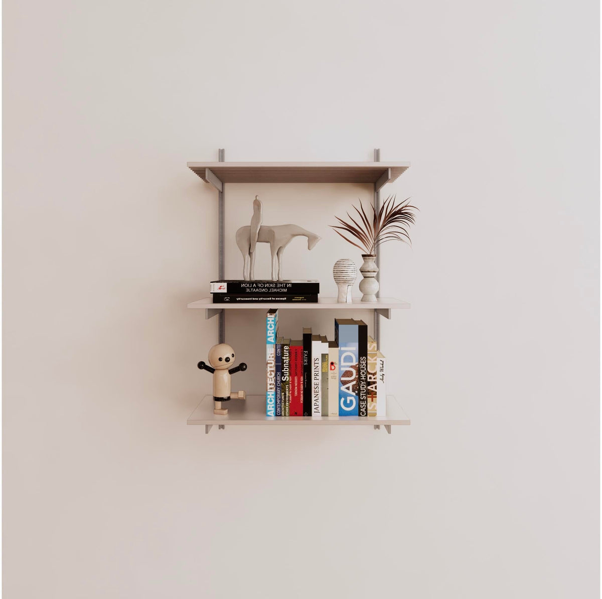 Modular shelving unit with white shelves, satin vertical posts, and one bay, shown with three open shelf levels.