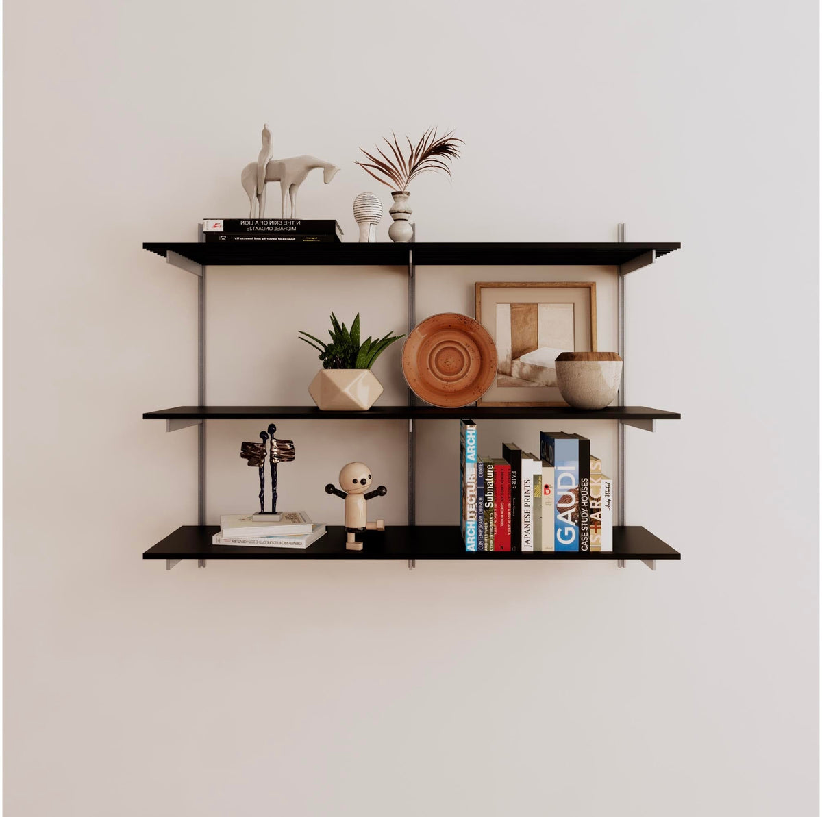 Modular shelving unit with black shelves, satin vertical posts, and one bay, shown with three open shelf levels.