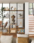 Aluminaire floor-to-ceiling room divider shelving unit with wood-look aluminum shelves, white vertical posts, one bay, 24-inch bay width, and six open shelf levels styled in a room setting.