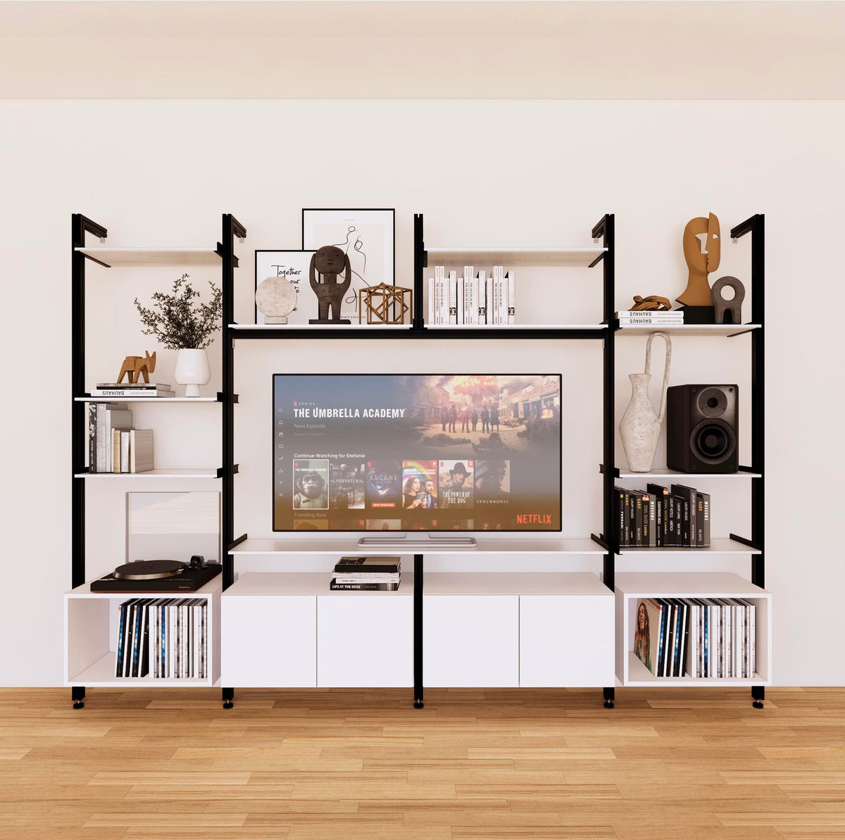 Harmony four-bay media unit with white shelves and black vertical posts, four bays, shown with open shelf levels.