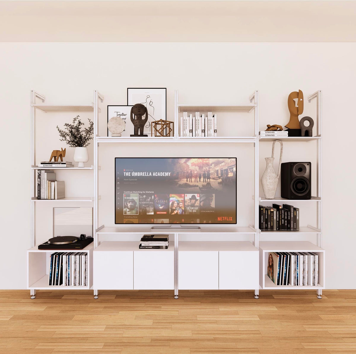 Harmony four-bay media unit with white shelves and white vertical posts, four bays, shown with open shelf levels.