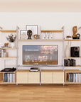 Harmony four-bay media unit with Casting Light shelves and satin vertical posts, four bays, shown with open shelf levels.