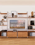 Harmony four-bay media unit with Tea for Two shelves and satin vertical posts, four bays, shown with open shelf levels.