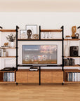 Harmony four-bay media unit with Tea for Two shelves and black vertical posts, four bays, shown with open shelf levels.