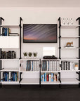 Four-bay media center shelving unit with white shelves and black vertical posts, four bays, shown with open shelf levels.