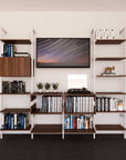 Four-bay media center shelving unit with wood-look shelves and white vertical posts, four bays, shown with open shelf levels.